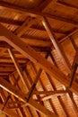 Beautiful sturdy wood architecture of interior roof or ceiling inside a house or building. Wooden beams and natural