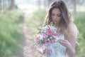 Beautiful stylish bride in a beautiful lush dress in the forest. Royalty Free Stock Photo