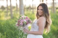 Beautiful stylish bride in a beautiful lush dress in the forest. Royalty Free Stock Photo