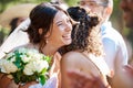 Beautiful stylish bride greeting and socialising with friends and family. Guests congratulating the bride on her wedding