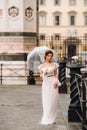 A beautiful stylish bride with an umbrella walks through the old city of Florence.Model with umbrellas in Italy.Tuscany Royalty Free Stock Photo