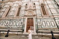 A beautiful stylish bride with an umbrella walks through the old city of Florence.Model with umbrellas in Italy.Tuscany Royalty Free Stock Photo