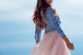 Beautiful and stylish brunette walking on the beach. Royalty Free Stock Photo