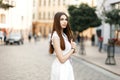 Beautiful stylish elegant brunette girl in a fashion white dress Royalty Free Stock Photo