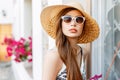 Beautiful stylish girl in a beach hat and sunglasses Royalty Free Stock Photo