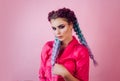 Beautiful stylish girl with colorful kanekalon braided in her hair. Pretty woman with colorful violet ombre hair and pro