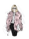 Beautiful stylish girl in a fur coat, trousers and glasses. Fashionable clothes and accessories. Fashion