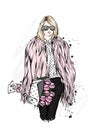 Beautiful stylish girl in a fur coat, trousers and glasses. Fashionable clothes and accessories. Fashion & Style.