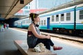 Beautiful stylish modern young woman waiting train Royalty Free Stock Photo