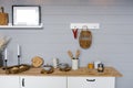 Beautiful stylish white real kitchen in Scandinavian style with wooden top and grey wooden walls Royalty Free Stock Photo