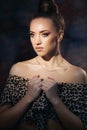 Beautiful stylish young girl in leopard print clothes. Fashionable clothes on a woman. Beautiful model with beautiful makeup and a Royalty Free Stock Photo