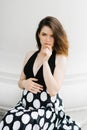 Beautiful stylish young pregnant woman holding her hand on her stomach Royalty Free Stock Photo