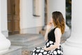 Beautiful stylish young pregnant woman holding her hand on her stomach Royalty Free Stock Photo