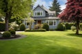 A Beautiful Suburban House With A Manicured Lawn And A For Sale Sign In The Front Yard