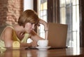 Beautiful successful woman working at coffee shop with laptop computer enjoying coffee cup Royalty Free Stock Photo