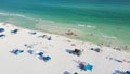 Beautiful sugar-white sand beaches and row of beach umbrella with family people gathering, relaxing, swimming on turquoise water, Royalty Free Stock Photo