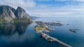 Beautiful summer aerial view of Reine, Norway, Lofoten Islands, with skyline, mountains, famous fishing village with red fishing c Royalty Free Stock Photo
