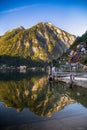 The beautiful summer alpine town of Hallstatt and the mountain lake Hallstatter See at sunrise. Beautiful natural summer