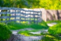 Countryside bokeh background in summer, wooden fence Royalty Free Stock Photo