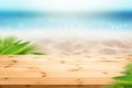 Beautiful Summer background wooden table top and blur sea sandy beach view with green plam leaves as frame Royalty Free Stock Photo