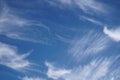 Beautiful summer blue sky with white feather clouds, natural background for banner.Soft spindrift clouds.Natural cloudy sky Royalty Free Stock Photo