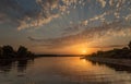 Summer evening bright sunset over the river. Royalty Free Stock Photo