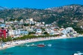 Beautiful summer cloud landscape of beach town of Himare at foot of  mountains on border of Ionian and Adriatic seas. Albania Royalty Free Stock Photo