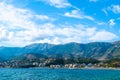 Beautiful summer cloud landscape of beach town of Himare at foot of  mountains on border of Ionian and Adriatic seas. Albania Royalty Free Stock Photo