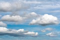 Beautiful summer clouds floating across sunny blue sky to change weather