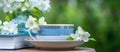 Beautiful summer composition of a cup of tea, book and Jasmine flowers on a natural green background, a concept of good morning, Royalty Free Stock Photo