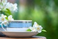 Beautiful summer composition of a cup of tea, book and Jasmine flowers on a natural green background, a concept of good morning, Royalty Free Stock Photo