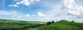 Beautiful summer countryside landscape against the background of blue sky and white clouds Royalty Free Stock Photo