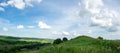 Beautiful summer countryside landscape against the background of blue sky and white clouds Royalty Free Stock Photo