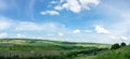 Beautiful summer countryside landscape against the background of blue sky and white clouds Royalty Free Stock Photo