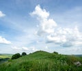 Beautiful summer countryside landscape against the background of blue sky and white clouds Royalty Free Stock Photo