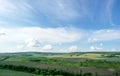 Beautiful summer countryside landscape against the background of blue sky and white clouds Royalty Free Stock Photo