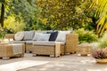 Summer day in elegant home garden with trendy furniture Royalty Free Stock Photo