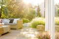 Summer day in elegant home garden with trendy furniture Royalty Free Stock Photo