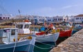 Beautiful summer day , marina of Greek island. Fishing boats moored at jetty. Mykonos, Cyclades, Greece. Whitewashed