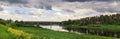 Beautiful summer day by the river, thunderclouds, Kraslava, Latgale, Latvia Royalty Free Stock Photo