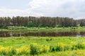 Beautiful summer day by the river, thunderclouds, Kraslava, Latgale, Latvia Royalty Free Stock Photo