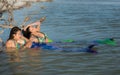 Mom and Daughter Mermaids basking in the Sun