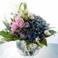 Flower bouquet, pastel-colored summer flowers in arrangement. Roses, hydrangea blooming in summer flower bunch Royalty Free Stock Photo