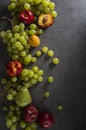 Beautiful summer fruits border on dark background