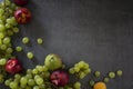 Beautiful summer fruits border on dark background