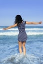 Beautiful summer girl jumping on the beach Royalty Free Stock Photo