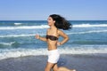 Beautiful summer girl jumping on the beach Royalty Free Stock Photo