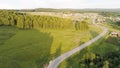 Beautiful summer landscape from a bird's-eye view. Scene.A long road with driving cars and a huge beautiful green Royalty Free Stock Photo