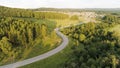 Beautiful summer landscape from a bird's-eye view. Scene.A long road with driving cars and a huge beautiful green Royalty Free Stock Photo
