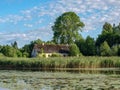 Beautiful summer landscape with calm lake, meadows, Royalty Free Stock Photo